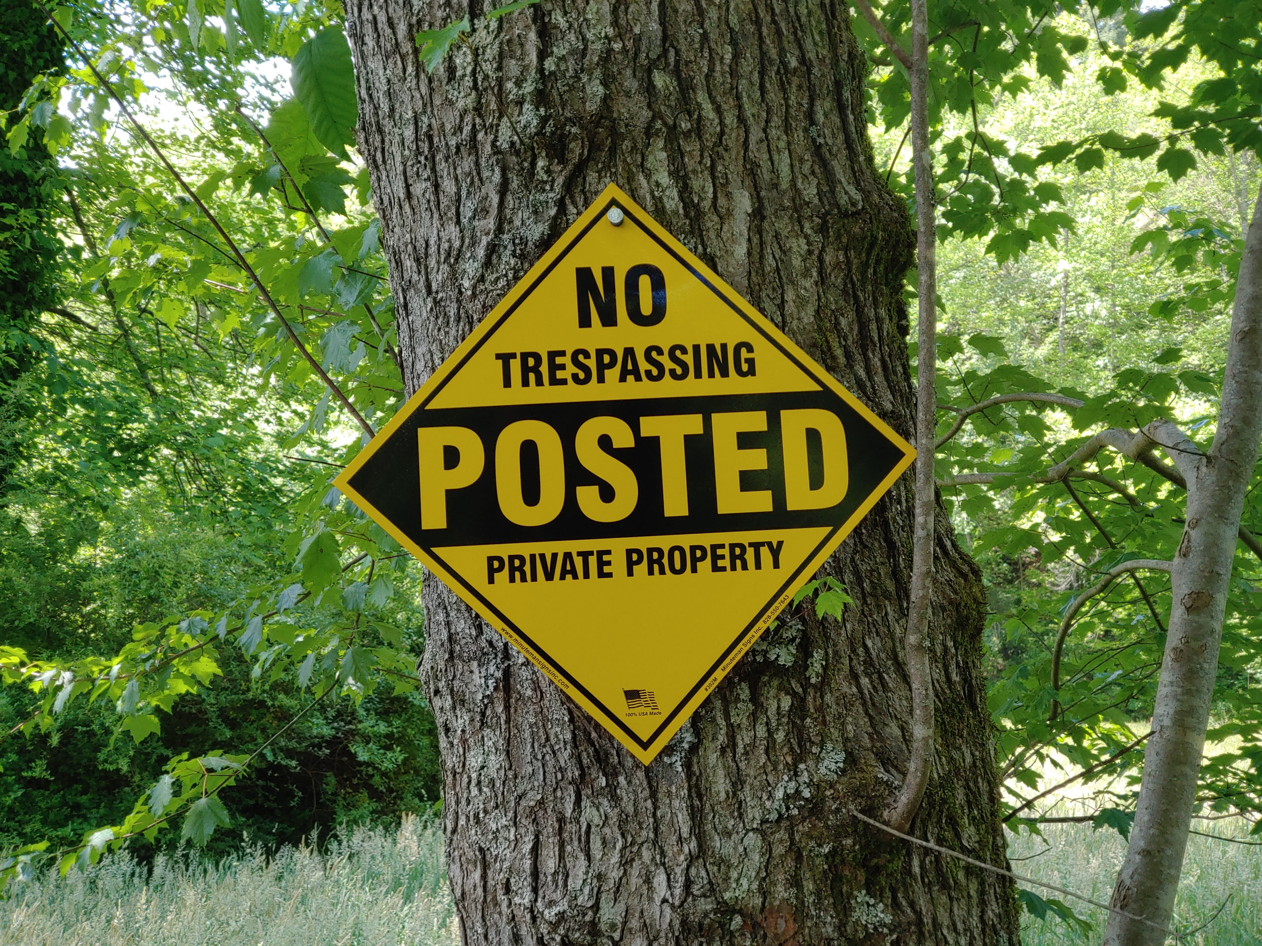 no-trespassing-posted-private-property-yellow-or-orange-aluminum-self